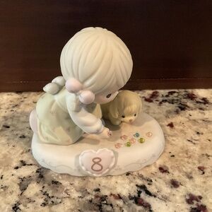 Precious Moments age 8